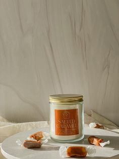 a candle sitting on top of a white table