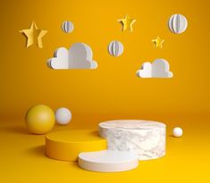 an image of a yellow background with clouds and stars in the sky on top of it