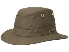 Tilley Endurables The Authentic - Caps : Olive : As one of their original five styles, the Tilley Endurables Authentic T5 hat is a time-tested fan favorite. Made with resilient duck cotton for long-lasting durability. UPF50+ sun protection. Full brim with sewn edge. Buoyant design with water-repellent finish. Secret pocket keeps small valuables in place. Brass grommets for added airflow. Front and rear wind cords keep hat in place. Hydrofil sweatband wicks away moisture. Spot clean. 100% cotton. Wicks, Repellent, Sun Protection, Water Repellent, Caps Hats, Accessories Hats, Hats