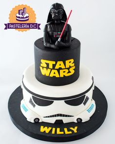 a star wars themed cake with a darth vader on top