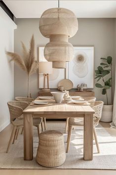 a dining room table and chairs with rattan lamps