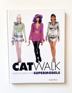 a book with three models on it