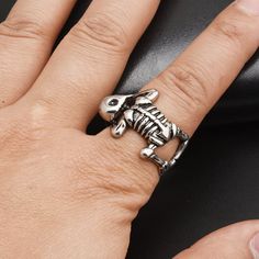 If you're searching for a unique and bold ring that stands out from the crowd, look no further than this adjustable unisex skeleton ring. Perfect for bikers, baristas, or bartenders, this eye-catching piece will ensure you always make a lasting impression. Embrace your individuality and showcase your edgy style with this unforgettable accessory. Why You'll Love It An eye-catching design: Get rid of the boring rings and get your hands on this uniquely impressive skeleton ring. Stand out in a crow Adjustable Silver Skull Ring Punk Style, Adjustable Silver Skull Ring In Punk Style, Adjustable Punk Rings For Halloween, Adjustable Vintage Metal Skull Ring, Vintage Adjustable Skull Ring For Halloween, Adjustable Vintage Skull Ring For Halloween, Adjustable Unique Metal Skull Ring, Adjustable Metal Skull Ring, Adjustable Punk Metal Rings