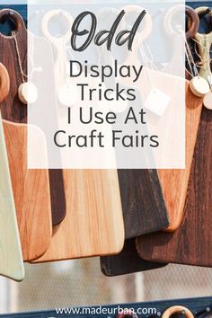 wooden cutting boards with text overlay that says odd display tricks i use at craft fairs