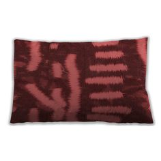 a red and black pillow on a white background