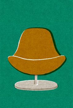 a brown hat sitting on top of a white plate next to a green wall and floor