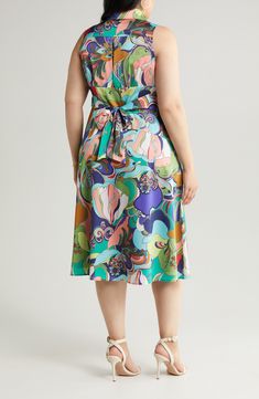 A vibrant retro print enlivens this rich satin midi designed in a sleeveless silhouette with a surplice V-neck and a shaping back tie. 47" length (size 1X) Spread collar Surplice V-neck Sleeveless Side-seam pockets Attached back sash Lined 100% polyester Dry clean Imported Men Home Decor, Hairstyling Products, Rollerball Perfume, Satin Midi Dress, Retro Print, Fragrance Design, Nordstrom Store, Retro Prints, Styling Tools