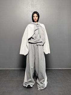 Composition : 100% cottonColor : GRAYCountry of Origin : Republic of Korea Long Sleeve Cotton Hooded Jacket For Loungewear, Cotton Hooded Outerwear For Loungewear, Gray Cotton Hooded Jacket For Loungewear, Cotton Hooded Jacket For Loungewear, Gray Cotton Outerwear With Relaxed Fit, Gray Cotton Hooded Jacket With Long Sleeves, Oversized Gray Cotton Hooded Jacket, Gray Cotton Hooded Jacket With Drawstring, Baggy Cotton Hooded Sweatshirt