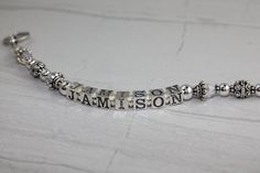 This custom sterling silver and Swarovski crystal bracelet is personalized with the names of children, grandchildren or pets. Up to five strands can be made in one bracelet. Sized according to wrist size. Perfect keepsake that will be cherished forever. $50 per strand (regularly $60 per strand. Please message us names and length needed. If you want a one strand you will order quantity 1, 2 strand quantity 2, 3 strand quantity 3 as so on.... (1 strand $50, 2 strands $100. 3 strands $150, 4 strand Personalized Sterling Silver Name Bracelet With Birthstone, Personalized Sterling Silver Birthstone Name Bracelet, Sterling Silver Nickel-free Name Bracelet For Birthday, Nickel-free Sterling Silver Name Bracelet For Birthday, Birthday Sterling Silver Nickel-free Name Bracelet, Adjustable Silver Name Bracelet With Birthstone, Silver Nickel-free Name Bracelet For Birthday, Personalized Silver Jewelry With Names, Silver Adjustable Name Bracelet For Personalized Gift