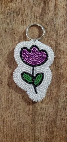 a beaded keychain with a flower on it