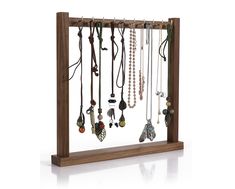 a wooden display with many necklaces hanging on it