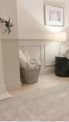 a living room filled with furniture and a fire place next to a white fireplace mantel