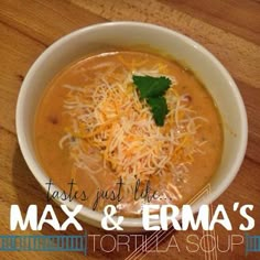 a bowl of soup with cheese and parmesan on top