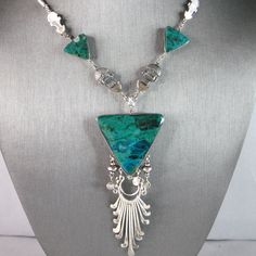 A Womens Vintage Estate Sterling Silver Chrysocolla Mayan Necklace. Necklace Weighs 36.1g And Measure 21" Long By 1 1/2" Wide. This Would Make A Nice Gift For That Someone Special. Any Questions Please Do Not Hesitate To Ask. Be Sure To Check Out Some Of My Other Great Items Up For Sale. Thank You Elegant Handmade Turquoise Chrysocolla Necklace, Elegant Green Turquoise Necklace In Chrysocolla, Elegant Green Chrysocolla Turquoise Necklace, Elegant Green Turquoise Chrysocolla Necklace, Luxury Sterling Silver Turquoise Necklace, Luxury Sterling Silver Necklace In Turquoise, Luxury Turquoise Sterling Silver Necklace, Elegant Turquoise Chrysocolla Necklace, Silver Turquoise Necklace With Chrysocolla Stones