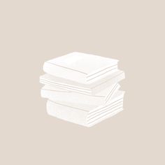 stack of white napkins on top of each other in front of a beige background