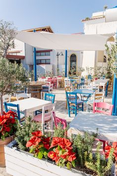 an outdoor dining area with tables and chairs