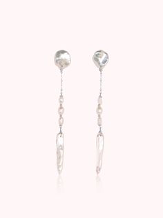 Effortless and light on your ears, these earrings feel unique and refreshing. Great with a white button down or paired with your favorite slip dress, these earrings are a great staple. Freshwater Pearls AAA Luster Pearls 14KT Gold-Filled or Sterling Silver Earring Length: 3" Please note - Freshwater Pearls & Gemstones are all natural and therefore unique, your Adorn Pili piece will be a one of one design. One Of One, White Button Down, Pearl Gemstone, Silver Earring, Fine Jewellery Earrings, Gold Filled Jewelry, 14kt Gold, One Design, White Silver