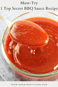 a spoon full of bbq sauce with the words must try top secret bbq sauce recipe