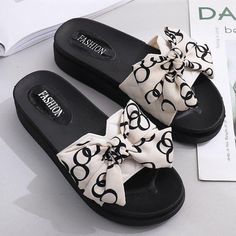 Women's Thick-Soled Bow Tie Slippers - AM APPAREL Trendy Textured Slip-on Platform Slippers, Comfortable Slip-on Flip Flops For Outings, Comfortable Cushioned Slip-ons For The Beach, Casual Cushioned Slip-on Platform Slippers, Trendy Slip-on Platform Slippers For Vacation, Comfortable Flat Slip-ons For The Beach, Trendy Non-slip Round Toe Slippers, Comfortable Eva Slippers With Round Toe, Comfortable Slip-on Slippers For Vacation