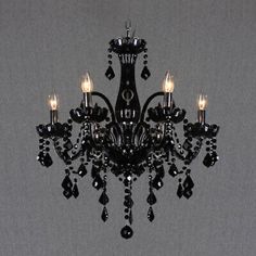 a black chandelier hanging from the ceiling