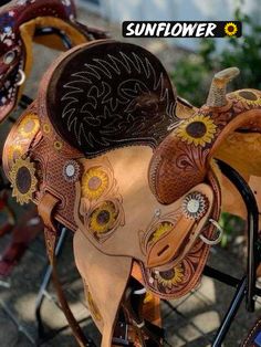 a close up of a horse saddle on a bike with the sunflower logo above it