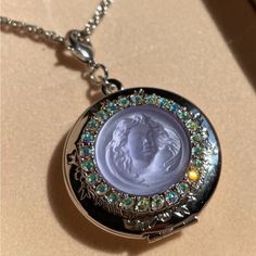 Vintage Kirks Folly Lavender Dream Angel Locket Necklace Silver Tone Opens From The Top. Can Hold Two Photos. Crystals Are Set Around An Iridescent Glass Cameo. The Back Of The Locket Is Engraved With The Words, "Love Never Dies.” Measures 30" Long Locket Is Approx. 1-1/2" Wide X 3/8 Deep. Has Lobster Claw Clasp On Locket And Chain. Aurora Borealis Rhinestones. New In Box Gothic Locket, Unique Locket Necklace, Angel Locket, Locket Necklace Silver, Vintage Locket Necklace, Charm Holder Necklace, Unique Locket, Jellyfish Pendant, Kirks Folly Jewelry