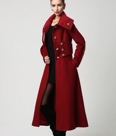 "This gorgeous long wool blend coat is highlighted by the over sized stand up collar and silver button detailing. When the collar is unbuttoned it falls nicely into a wide shawl-like lapel. The form fitting bodice leads into a long flowing skirt giving a nice accent of femininity to counterbalance the military styling. One of the nicest details is the wide cumber band style waistband that really accentuates the waist. The designer red wool coat is fully lined in polyester with deep side pockets. Red Wool Coat With Buttons For Winter, Red Long Wool Coat With Buttons, Military Long Coat, Red Long Coat, Long Flowing Skirts, Military Chic, Military Style Coats, Red Wool Coat, Simply Red