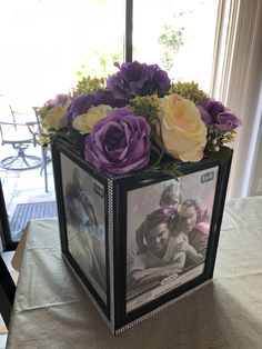 a vase with flowers in it sitting on a table