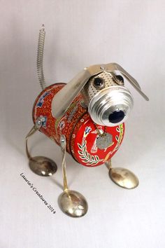 a dog made out of tin cans and spoons