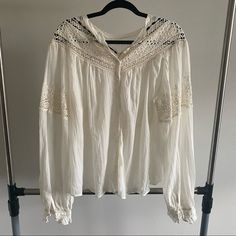 Free People Off White Eyelet Oversize Blouse - Beautiful Embroidery On Shoulders And Chest - Buttons Closure In Sleeves - Button Up Front Top Casual White Blouse With Boho Collar, White Long Sleeve Top With Boho Collar, Bohemian Off White Long Sleeve Top, Chic White Peasant Top With Lace Trim, White Boho Collar Blouse For Spring, White Spring Blouse With Boho Collar, White Bohemian Peasant Top With Lace, White Blouse With Boho Collar For Spring, Off White Long Sleeve Bohemian Blouse