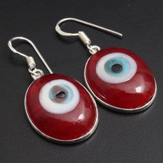 Evil Eye Gemstone, Beautiful Earrings Jewelry, 925 Sterling Silver Plated Jewelry, Gift For Her, Handmade Earring Jewelry, Christmas Gift Materials Sterling Silver Plated Earrings Size - 1.6 x 0.7 Stone Name - Evil Eye  Stone Color - Red Shipping Policy We do ship through DHL, UPS, INDIA POST. The rest of the Earrings is made from 925 Sterling silver Plated 92.5% pure silver Plated . And it doesn't have any lead or nickel. I make more than 50 different gemstones. If you want other gemstones, Ple Spiritual Sterling Silver Earrings For Anniversary, Oval Pierced Earrings As Gift, Oval Pierced Earrings For Gift, Spiritual Earrings As Gift, Spiritual Oval Earrings As Gift, Handmade Oval Earrings For Gift, Spiritual Oval Earrings For Gift, Spiritual Round Earrings For Gift, Spiritual Style Sterling Silver Earrings For Gift