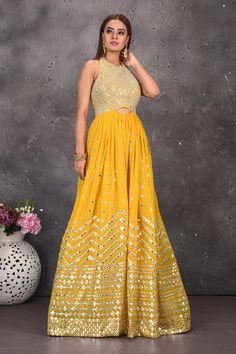 Look stylish at wedding festivities in this gorgeous modern ethnic yellow halter neck mirror work jumpsuit with halter neck. Shop designer dresses in USA from Pure Elegance.