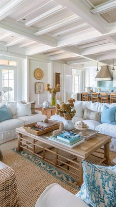 a living room filled with lots of white furniture