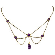 THIS IS A STUNNING VICTORIAN - ART NOUVEAU - BELLE EPOQUE FESTOON NECKLACE WITH THE MOST GORGEOUS NATURAL ROUND AND BRIOLETTE CUT SIBERIAN AMETHYST GEMS SET IN A GORGEOUS OPEN WORK FESTOON SWAG DESIGN IN 14 KARAT ROSE GOLD DATING TO CIRCA 1880. These festoon necklaces are so lovely and hang beautifully around the neck. The color of these Amethysts is an extraordinary vivid royal purple! The design is full of the delicate romance of the age and is so special with the amethysts which are all the r Victorian Jewelry Tattoo, Siberian Amethyst, Womens Necklaces Silver, Victorian Pendant Necklace, Cuff Tattoo, Swag Design, Briolette Necklace, Festoon Necklace, Gold Drop Necklace