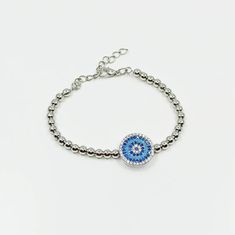 Evil Eye Bracelet is adjustable so it comfortably fits on any wrist. Turkish bracelet is beaded with gold and silver beads. Evil Eye on the bracelet is made of zircon. This nazar, cz bracelet is great for daily wear. It is tarnish resistant. Dainty evil eye bracelet would be a perfect birtday gift or Christmas gift. For more evil eye bracelets, click the link below; https://www.etsy.com/shop/EyeDesignsbyGG?ref=search_shop_redirect&section_id=30219689 Adjustable Jubilee Crystal Bracelet, Adjustable Round Jubilee Crystal Bracelet, Adjustable Silver Beaded Bracelet With Evil Eye, Adjustable Silver Round Evil Eye Bracelet, Adjustable Silver Beads Charm Bracelet, Adjustable Charm Bracelet With Silver Beads, Adjustable Silver Beads Bracelet, Adjustable Silver Chain Bracelet With Evil Eye, Turkish Bracelet