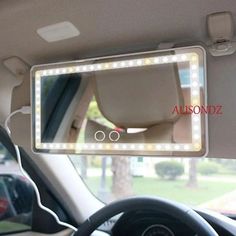 an image of a car mirror that is on the front of a vehicle with lights