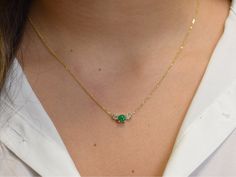 a statement necklace made with a round emerald accented with 2 diamonds . Both the emerald and diamonds are natural . the emerald is 0.62 carat medium to dark color with no enhancements and SI clarity ( slight natural inclusions ) and the diamonds are 0.48 carat total SI 1 clarity and G-H color. the gems are set in prong setting. i also make this necklace in 14k white gold and 14k rose gold. the chain is a 1 mm cable link chain with a lobster lock Material : 14k solid gold available in white gol Simple Emerald Necklace, Emerald And Diamond Necklace, Emerald Necklace Pendant, Emerald Necklace, Dark Color, Green Emerald, Three Stone, Stone Necklace, Link Chain