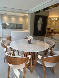 a white table and chairs in a room