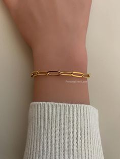 This  listing is for one paperclip chain bracelet.   If you need larger quantities, then please let me know! Thank you! Materials: *18K Gold color Stainless Steel *Link size: 4x12mm *Length: Choose your length from the drop down menu. All orders are shipped Monday-Friday with the exception of holidays. All delivery dates are estimated dates only. There is always the possibility that the shipping carrier may experience delays in delivery.  Due to the nature of the items I sell I do not accept ret Modern Paperclip Bracelets As Gifts, Trendy Paperclip Chain Bracelet For Gift, Trendy Paperclip Bracelet For Gift, Trendy Cable Chain Bracelet As A Gift, Gold Paperclip Bracelets For Everyday, Gold Paperclip Bracelet Perfect As Gift, Classic Gold Chain Paperclip Bracelet As Gift, Classic Gold Chain Paperclip Bracelet Gift, Gold Paperclip Bracelet As Gift