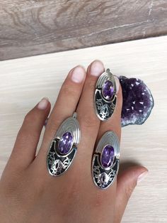 Armenian ornament ring and earrings in high quality sterling silver 925. The set is combined with purple zircons. Besides that stones we can make this set with any natural stones and minerals, also with another color of zircon. For the same model with red zircon, click here: https://etsy.me/2MDovFj For natural labradorite, click here: https://etsy.me/38iT0sl For natural variscite, click here: https://etsy.me/3nkk5jl For natural lapis lazuli, click here: https://etsy.me/3rXQMGC For custom one, cl Silver Oval Hand Set Rings, Oval Silver Hand Set Rings, Hand Set Oval Silver Rings, Sterling Silver Jewelry With Purple Stone Setting, Purple Sterling Silver Jewelry With Stone Setting, Purple Sterling Silver Ring, Oval Amethyst Ring With Sterling Silver Setting, Oval Amethyst Ring With Stone Setting In Sterling Silver, Sterling Silver Rings With Matching Earrings