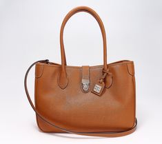 Pulled straight from the archives, this fine leather tote looks just as chic now as it did back in 2006. The tucklock closure is a standout detail that not only adds visual interest, it also secures your personal belongings. From Dooney & Bourke. Dooney Bourke, Fashion Handbags, Tote Handbags, Leather Tote, Zip Pockets, Handbags, Leather