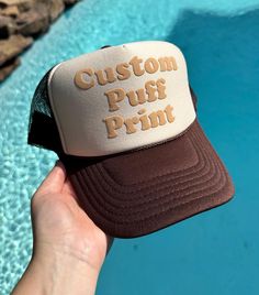 HOW TO ORDER Please check and review the product photos. Choose your hat color. Choose your puff color. Please add your personalization. Click "Add To Cart". You may go back to add as many variations as you would like, or you may simply checkout.  If you have any questions, we are always here to help.  PRODUCT DETAILS Our puff print hats are a perfect blend of style and comfort! Hand crafted with care, these hats have a 100% polyester front and mesh back, giving you that classic yet breathable f Hat Custom, Puff Print, Hat Ideas, Quality Hats, Print Trends, Product Photos, Hat Designs, Trucker Cap, Fashion Statement