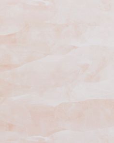 a white marble textured background with light pink hues