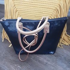 Fine Quality Patent Leather Logo Ocean Blue Satchel. Clean Interior With 3 Pockets, One Zippered. Leather Bottom With Brass Feet (Some Minimal Discoloration On Tips). Tan Leather Straps (Minimal Wear On One) With Signature Red Stitching. Detachable Shoulder Strap. All Leather. Excellent Pre-Worn Condition. Measures... Navy Ocean Blue 13.5" X 9" X 4" Drop Handle 6" Shoulder Drop Strap 22" Gold Hardware Blue Coated Canvas Satchel Bag, Blue Coated Canvas Satchel, Blue Coated Canvas Top Handle Shoulder Bag, Blue Coated Canvas Bags With Double Handle, Blue Coated Canvas Bag With Handles, Elegant Blue Coated Canvas Bag, Blue Coated Canvas Shoulder Bag With Removable Pouch, Blue Coated Canvas Shoulder Bag For Everyday Use, Blue Coated Canvas Shoulder Bag