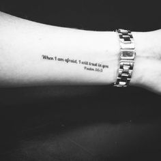 a person's arm with a quote on it