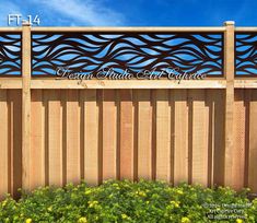 a wooden fence with an intricate design on it's top and bottom panel, along with flowers in the foreground