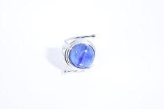 great color Deep blue Kyanite stone surrounded by a cool modern setting The setting is handcrafted in Sterling silver Size 7.5 Can be sized All rings are shipped in a nice gift box. Check out our over a THOUSAND great reviews Engraving is $4 per letter and is not always perfect depending on the piece. It can take a few days if the jeweler is busy. This is payable to Paypal Judithsltd@gmail.com Modern Cabochon Sapphire Ring For Gift, Round Cabochon Sapphire Ring For Gift, Round Cabochon Sapphire Ring, Sapphire Moonstone Ring In Sterling Silver As Gift, Blue Fusion Style Round Rings, Blue Oval Amethyst Ring In Sterling Silver, Silver Sapphire Ring With Polished Finish Gift, Blue Moonstone Sterling Silver Ring Gift, Blue Moonstone Ring In Sterling Silver As Gift