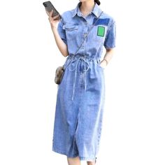 Welcome to the 2023 Spring-Summer Collection ââ‚?introducing our long denim dress with drawstrings for the ultimate 90s look!Why You'll Love ItThis light wash. baggy dress is designed to take you on a nostalgic journey back to the '90s. Crafted with premium quality denim. it's not just a dress; it's a statement. an anthem. a vibe! Its distinctive drawstrings. buttoned closure. and edgy distressed pattern make it the perfect embodiment of contemporary fashion with a side of grunge.Key Highlights: Short Sleeve Drawstring Summer Dress, Casual Cotton Dresses With Tie Waist, Casual Blue Dress With Drawstring, Casual Cotton Denim Midi Dress, Casual Midi-length Denim Dress, Relaxed Fit Short Sleeve Dress With Drawstring, Relaxed Fit Dresses With Drawstring And Short Sleeves, Relaxed Fit Dress With Drawstring And Short Sleeves, Casual Dresses With Relaxed Fit And Drawstring