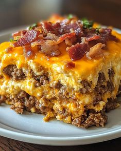 a close up of a plate of food with meat and cheese on it, sitting on a table