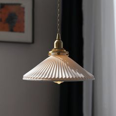 a light hanging from a ceiling in a room